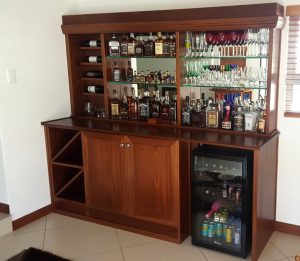 Drinks Cabinet in Mahogany with Silver mirrors and 10mm glass shelves in the displays and LED lighting.