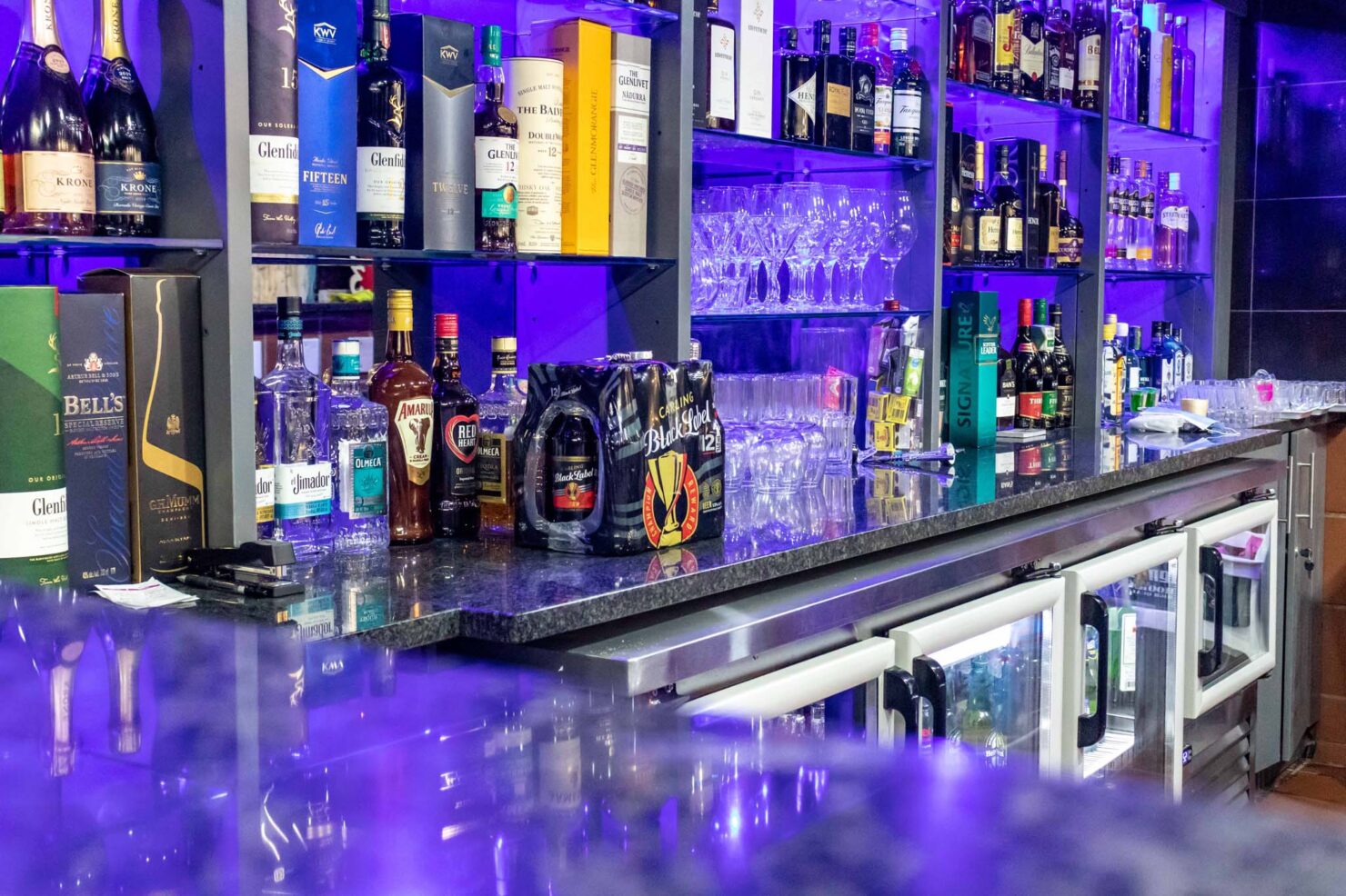 Bar with Rustenberg black Granite counters and Grey printed Melamine cupboard doors and drawers